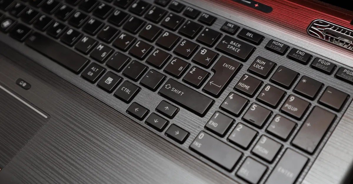 laptop keyboard types wrong characters close-up of laptop keyboard